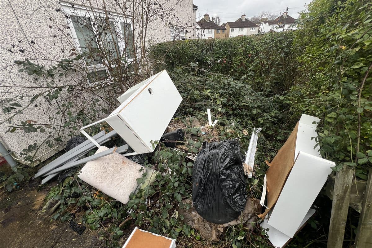 Front garden clearance with bulky household and outdoor waste ready for collection